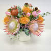 A celebration of bold, artistic floral design featuring striking King Protea, vibrant