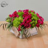 Pink roses and green pom-pom flowers in a rustic wooden box