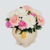 This little elephant will melt your heart with pink carnations, white carnations