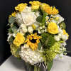 A lavish seasonal arrangement, with our most premium floral varieties in shades