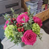 Stunning mix of Hot Pink Full Monte roses arranged with green hydrangeas