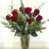 Bouquet of red roses in a clear glass vase