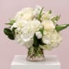 White floral bouquet in a clear glass vase