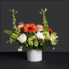 
Gerber daisies, hydrangea, protea, Bells of Ireland, Ranunculus, roses, hypericum, carnations, and