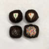 An assortment of 4 chocolate truffles in a box. 

Allergy Information:
Equipment is