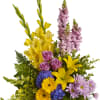 Mixed flower basket with yellow lilies, purple roses, and pink snapdragons