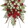 Standing red and white floral spray on an easel