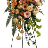 Tall floral standing spray with yellow lilies, roses, and gerbera daisies