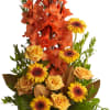 Orange gladiolus and yellow roses with gerbera daisies in a brown vase