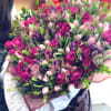A breathtaking grand luxury bouquet filled with vibrant pink roses, lavender tulips