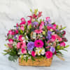 A vibrant and soft floral basket filled with a beautiful mix of