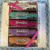 Gift box of Jersey Girl chocolate bars tied with pink ribbon