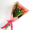 Tulip Meadow showcases fresh tulips complemented by beautiful wax flower for a