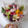 Our florist designs a beautiful bouquet with mixed flowers and colors using