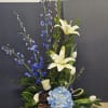 Beautiful arrangement with a mix of blue and white flowers