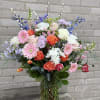 A sympathy Floral design which signifies the brightness of a special persons