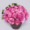 This mini ball of purple Roses is stylishly crowned with tropical leaves