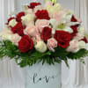 This stunning bundle features a breathtaking bouquet of classic red, pink, white