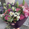 This bouquet is designed with pink roses and lilies with a touch