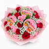 A playful bouquet of one 1 dozen Ecuadorian roses, pink carnation, baby&rsquo;s
