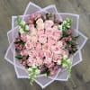The Pink Petal Wrap is a hand-tied bouquet featuring a mix of