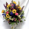 This grand arrangement features sunflowers, brightly colored roses, snapdragons, alstromeria and more!