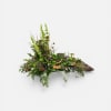 This natural selection of greenery honors your loved one in a uniquely