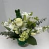 Lucky St. Patricks Day arrangement with lilies, roses and seasonal blooms.