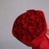 Bouquet of red roses wrapped in red paper