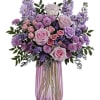What a delight! Overflowing with pink roses and lavender blooms, this decadent