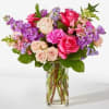This bouquet is a celebration of color, texture, and pure joy. Lush