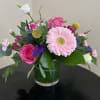 An assortment of bright and beautiful flowers meticulously arranged in a clear