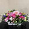 Assortment of fresh blooms beautifully arranged in a white washed wooden box