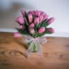 A vase full of blushing pink tulips!