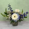 Whispering Winds Cylinder by Savilles Florist is a stunning display of blue