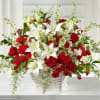 Red roses and white lilies in a white basket