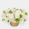 Structured yet effortlessly chic, this monochrome arrangement of roses, ranunculus, sweet peas