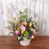 Make someone smile with this spring basket of fresh flowers. 