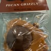 Pecans topped with creamy caramel and pure milk chocolate