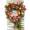 this beautiful heart shaped wreath is made up of pink, yellow and