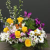 Mom's garden comes together in this basket of beautiful roses, larkspur, daisys