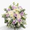 Soft, romantic, and full of natural charm, this elegant hand-tied bouquet features