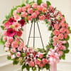 A beautiful pink standing wreath designed to honor and celebrate a cherished
