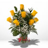 Yellow roses in a clear glass vase with white baby's breath