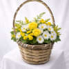 A bright and cheerful floral arrangement designed in a classic woven basket.