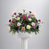 Celebrate the beauty of life with our Carnation Comfort funeral basket, a
