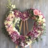 This beautiful open heart wreath is a stunning tribute to a loved