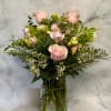 This arrangement is over flowing with an underated flower known as Freesia.