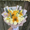 All in one bouquet, roses sunflowers tulips eucalyptus.

Tulips color will depend on