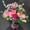 This amazing mixed vase focuses on flowers in hues of pink and